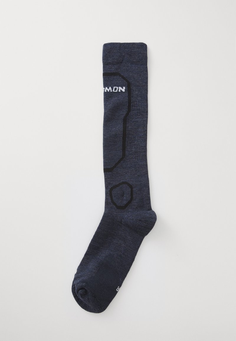 Calzino blu navy al ginocchio con motivi in outline neri e testo bianco parzialmente visibile su sfondo bianco uniforme.