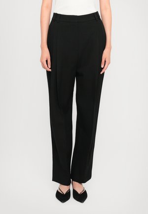 Black wide-leg trousers made of smooth fabric, featuring a high waist with belt loops, and sharp creases down the front.
