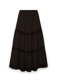 Jupe longue noire à volants superposés. Confectionnée dans un tissu doux, avec des accents de bordure en dentelle le long des coutures. Taille élastique pour un port facile.