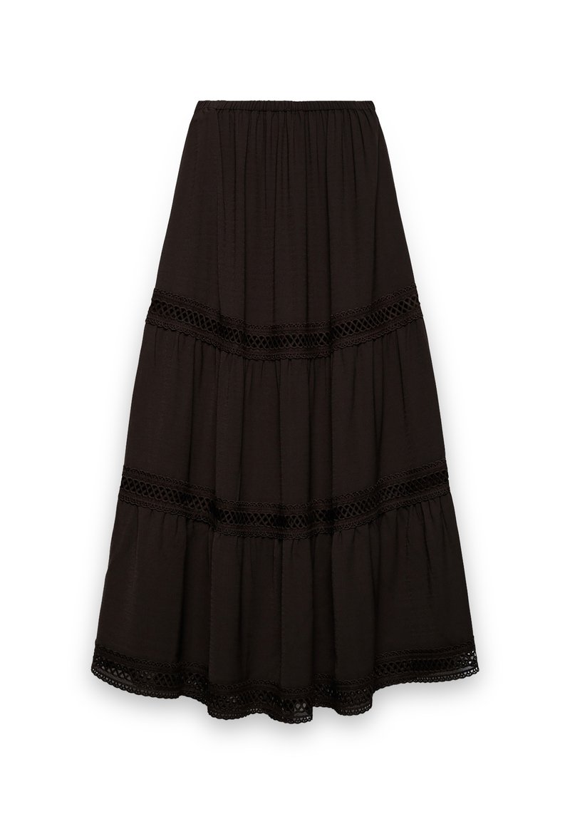 Jupe longue noire à volants superposés. Confectionnée dans un tissu doux, avec des accents de bordure en dentelle le long des coutures. Taille élastique pour un port facile.