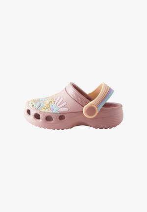 Pink rubber clog featuring floral embellishments, a textured surface, and a multicolor adjustable strap at the back. Ventilation holes on the sides.