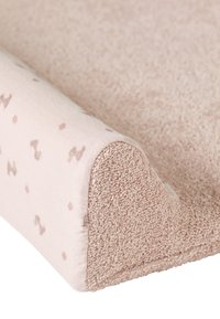 Soft pink changing pad with textured terry cloth surface. Rounded edges and subtle patterns add visual interest. Smooth fabric cover.