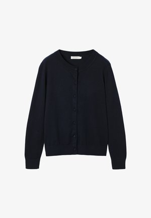 Tumši zils kardigans ar garām piedurknēm, apaļu kakla izgriezumu un pogām priekšpusē, kas pārklātas ar tādu pašu audumu.