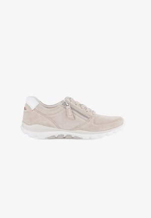 Beige suede sneaker with white rubber sole, lace-up front, side zipper, and white heel tab.