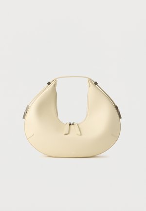 Beige crescent-shaped handbag with double zipper closure and short handle, featuring silver hardware details on sides.