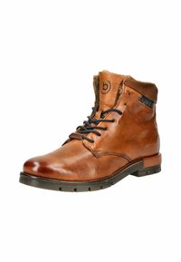 Braune Leder-Ankle Boots mit einer strukturierten Oberseite, Kunstfellfutter und schwarzen Schnürsenkeln. Sie verfügen über eine Gummisohle und genähte Details.