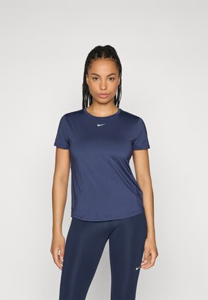 Navy blue athletic t-shirt made from a smooth fabric with a round neckline and short sleeves. Features a white Nike logo on the chest.