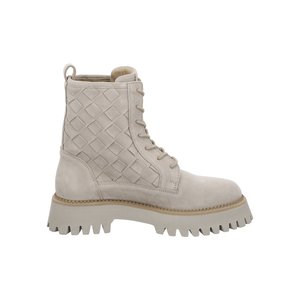 Beige suede lace-up boot with quilted diamond pattern on side, chunky ridged sole, and pull tab at heel.