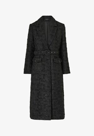 Black textured long coat with a belted waist, notch collar, long sleeves, and two front buttoned flap pockets.