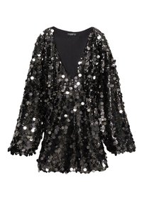 Mustapusero, jossa on syvä V-kaula-aukko, pitkät hihat ja löysä istuvuus. Kangas on peitetty kiiltävillä pyöreillä paljeteilla, jotka kattavat koko pinnan.