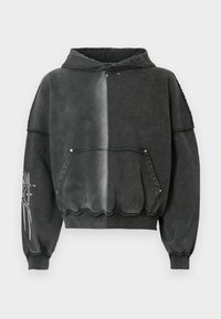 Sweatshirt preta oversize com efeito degradé, com bolso frontal, punhos canelados e estampa gráfica detalhada na manga. Material macio.