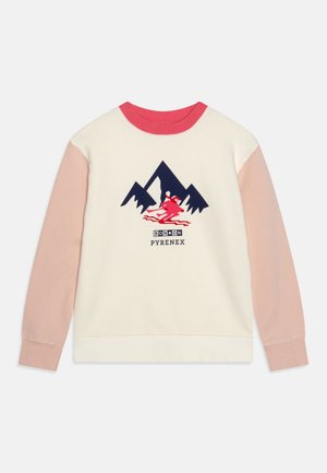 Sweat-shirt blanc avec manches roses, col rouge. Illustration de montagne et skieur en bleu et rouge. Texte "BON*ON PYRENEEX" sous l'illustration.