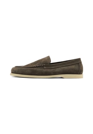 Brown suede slip-on shoe with stitched detailing and a light-colored rubber sole. Features a low profile and smooth texture.