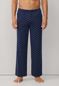 Pantalones de pijama azul marino con un patrón geométrico en azul claro, cinturilla elástica, diseño de pierna recta y textura de tela suave.