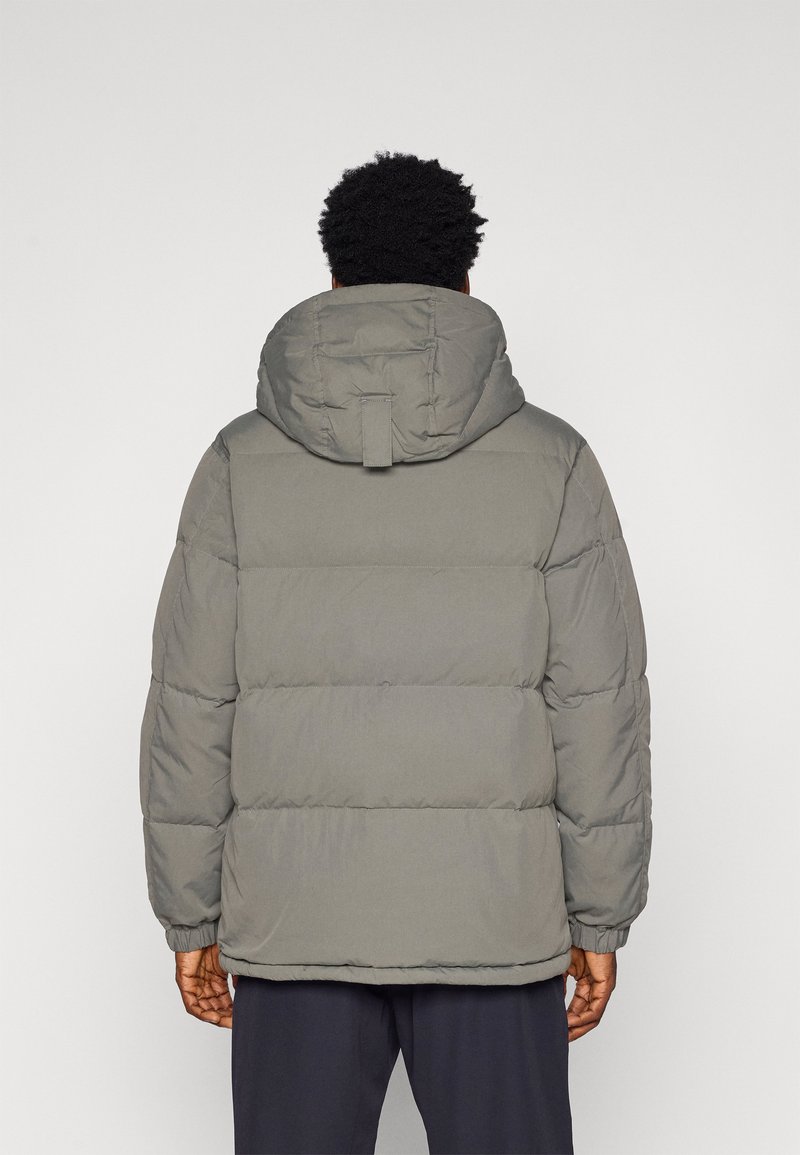 Gray puffer jacket with a hood, featuring a quilted design, elastic cuffs, and a straight hem. No visible logos or patterns.