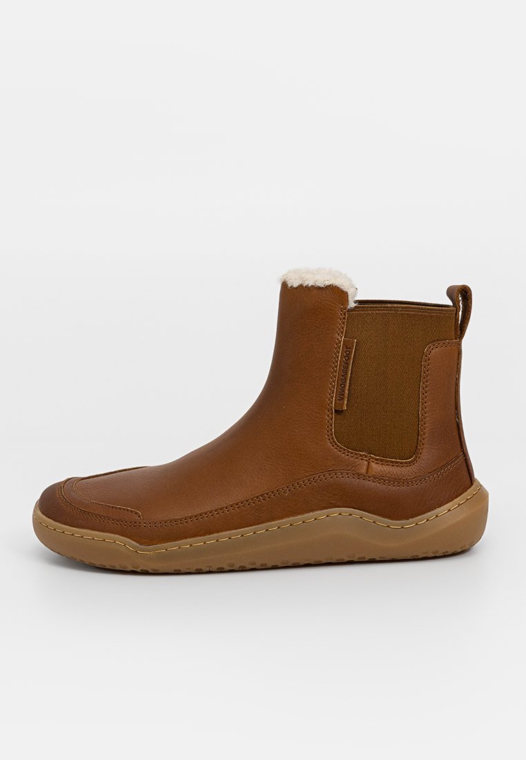 Braune Leder-Ankle-Boots mit einem weichen Futter, elastischen Seitenpanelen und einer Gummisohle. Verfügt über eine detailreiche Naht entlang der Naht.
