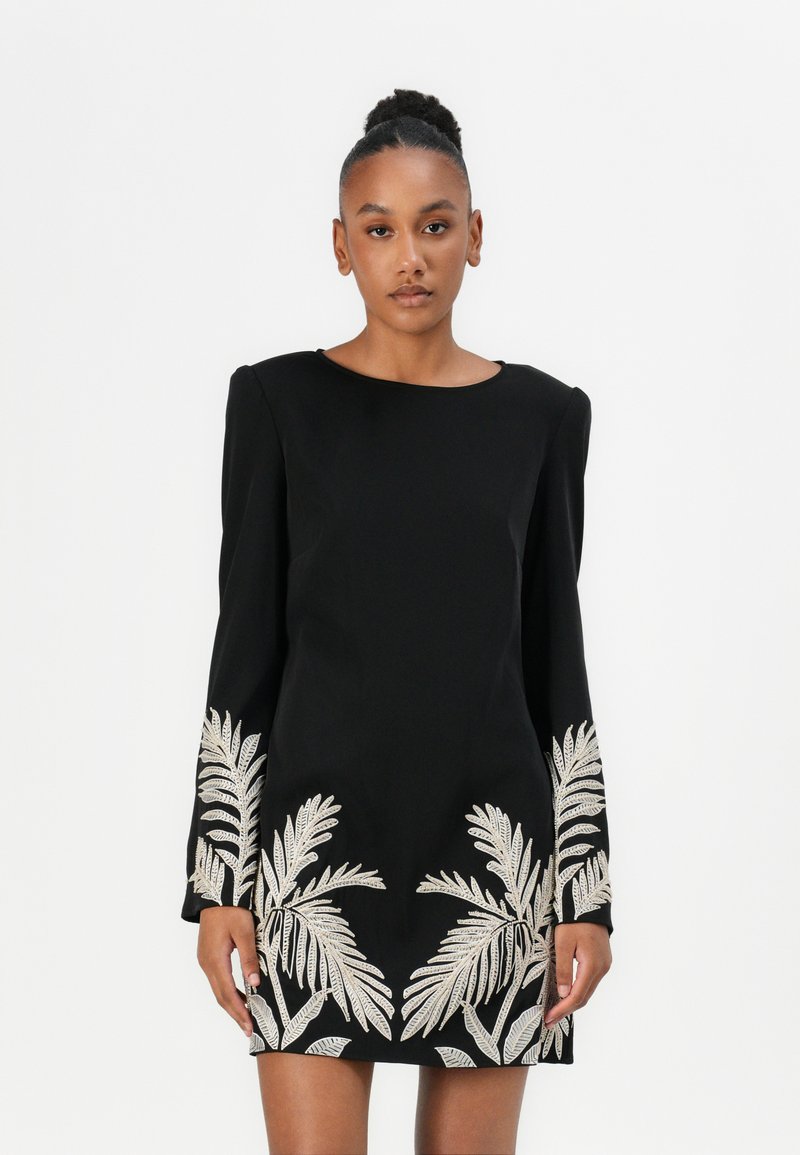 Black long-sleeve dress with a round neckline, featuring metallic silver palm leaf embroidery on the sleeves and lower hem. Smooth fabric texture.