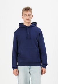 Maglia a coste con cappuccio ricamata Medusa | IT