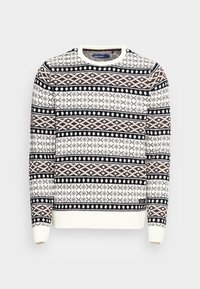 Neulepaita kermaan, jossa ruskeita ja laivastonsinisiä geometrisia kuvioita. Pyöreä pääntie sekä resorit hihansuissa ja helmassa.