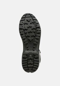 Suela de zapato de goma negra con patrones profundos de dibujo para tracción, con texturas hexagonales y detalles ventilados. Marcada con el logo "HHL".