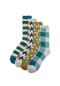 Conjunto de cuatro calcetines con diferentes текстuras y patrones: rayas, chevron, lunares y cuadros en tonos teal, oliva, crema y gris.