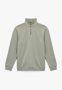 Sudadera de cremallera verde claro con cuello alto, mangas largas y puños y bajo de canalé. Tejido suave y texturizado con un diseño minimalista.
