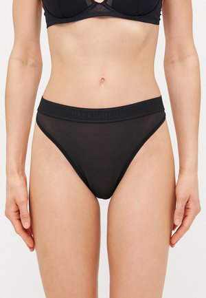 Slip bikini neri realizzati in un tessuto liscio e elastico con una vita elastica. Il nome del marchio "Polo Ralph Lauren" è impresso sulla banda.