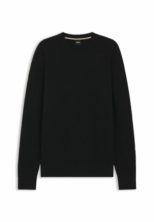 Pull en maille noire avec un col ras du cou, doté d'un ourlet et de poignets côtelés. Fabriqué en tissu doux avec un motif en grille subtil.