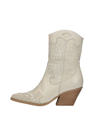 Botki kowbojki i motocyklowe