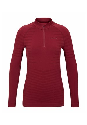 Red long-sleeve top with a zip neck, featuring a textured pattern and fitted design. Made from a stretchy, lightweight fabric.