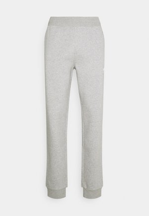 Pantalon de survêtement gris en coton mélangé doux, avec une taille élastique et des poignets resserrés. Aucune motif visible ni détail matériel.