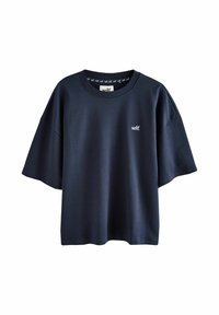 Oversized T-Shirt in Marineblau aus weichem Stoff mit kurzen Ärmeln und runder Ausschnitt. Mit kleinem weißen 'self.' Logo auf der Vorderseite.