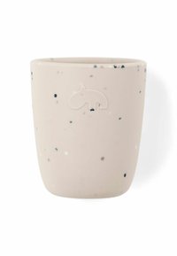 Taza de cerámica beige con manchas negras y blancas, que presenta un diseño en relieve de hipopótamo en un lado y una textura suave y mate.