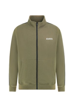 Green zip-up sweatshirt with a high collar, front pockets, and black side stripes. Features a white "GUESS" logo on the chest. Smooth texture.