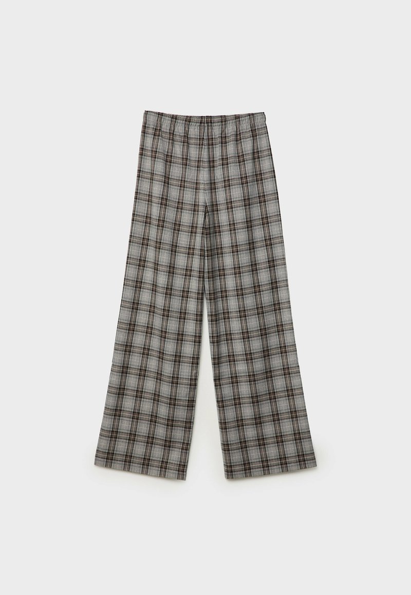 Graue karierte weite Hosen mit einem elastischen Bund. Mit braunen und schwarzen Linien in einem Rautenmuster. Hergestellt aus einem weichen, gewebten Stoff.