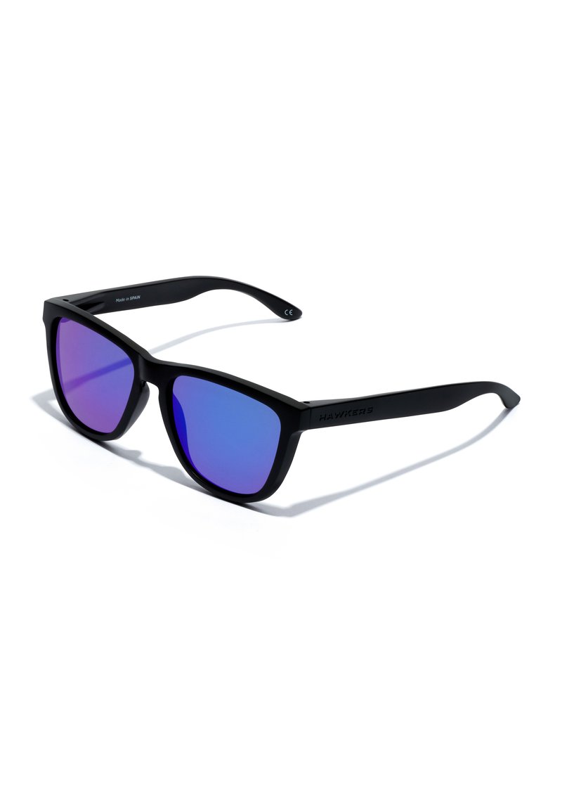Black sunglasses with a matte finish, featuring gradient purple lenses. Straight arms and angular design with branding on the temple.