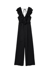 Combinaison noire sans manches à jambes larges, décolleté en V profond, bordure à volants, col noué dans le dos, et ceinture attachée à la taille.