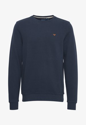 Sweatshirt bleu marine à col rond en coton, avec des manches longues, des poignets et un ourlet côtelés, et un petit badge en cuir marron sur la poitrine.
