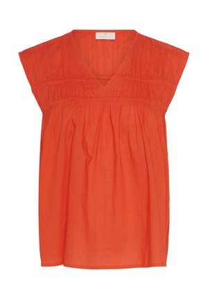 Haut orange ample avec un col en V, des manches courtes et des détails froncés autour du buste. Fabriqué en tissu léger.