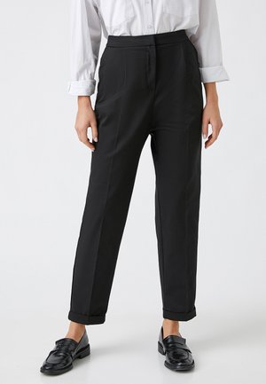 CARROT - Trousers - black