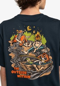 Navy blue t-shirt featuring a colorful, detailed graphic of a campfire scene with characters, trees, and the text "THE OUTSIDE WITHIN."