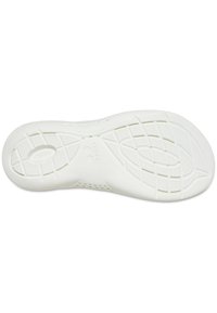 Suola di scarpa bianca in gomma con un motivo di grip testurizzato, scanalature ovali e rettangolari e loghi rotondi per una maggiore aderenza e supporto.