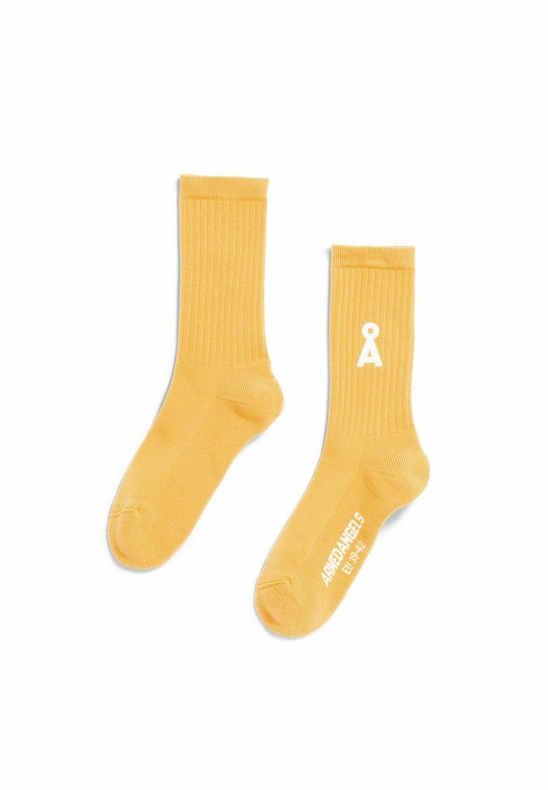 Gelbe, gerippte Sportsocken aus Baumwollmischung mit weißem Logo und Textdetails, weicher Textur und Standard-Sockenform.