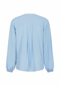 Blusa a maniche lunghe azzurro chiaro realizzata in tessuto morbido, con dettaglio di piega sul retro e polsini elasticizzati. Semplice scollatura rotonda.