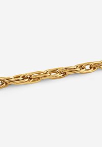 Gold chain with interlocking oval links, featuring a smooth, shiny surface and a uniform design. Flexible and sturdy in appearance.