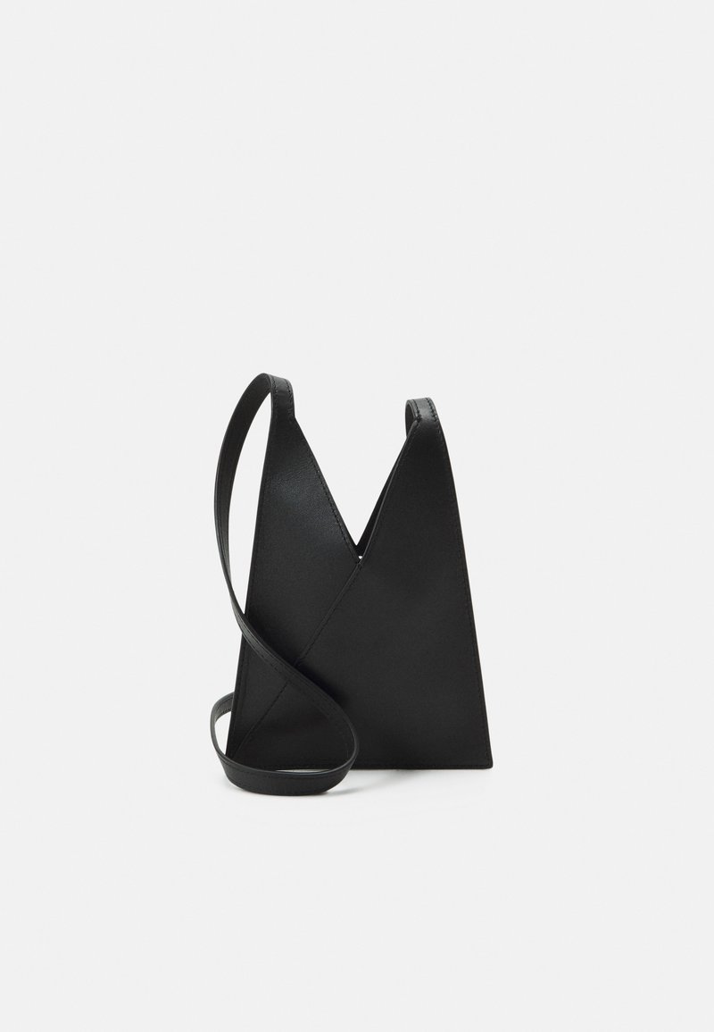 Black leather crossbody bag with a unique V-shaped design, smooth texture, and a single adjustable strap. Minimalistic and sleek appearance.