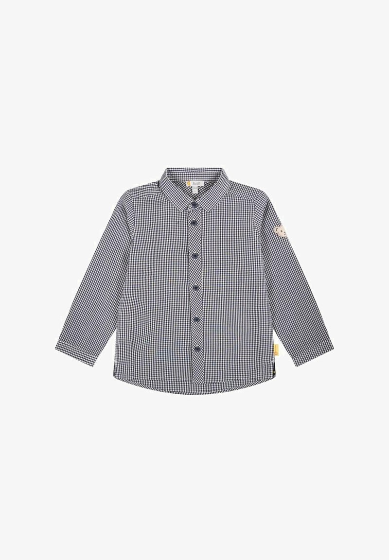 Chemise enfant à manches longues avec boutons, motif vichy noir et blanc et un petit patch ourson sur la manche gauche.