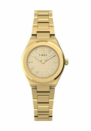 Reloj de pulsera de metal con tono dorado, con brazalete de eslabones, esfera redonda texturizada, marcadores de hora y manecillas doradas, y el logo "TIMEX" debajo de la posición de las 12 en punto.