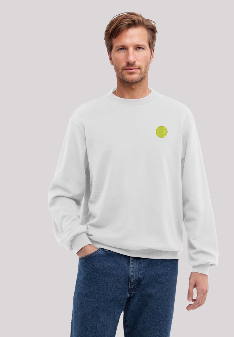 White sweatshirt with a crew neck, featuring a small green tennis ball graphic on the chest. Soft fabric and relaxed fit, with long sleeves.