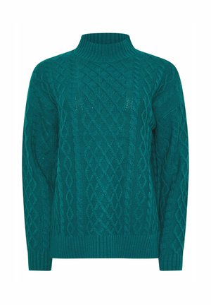 Sinih neulepusero, jossa on korkea ribattua kaulusta, monimutkaisia kaapelikuviota ja pitkät hihat ribatuilla hihoilla ja helmalla.